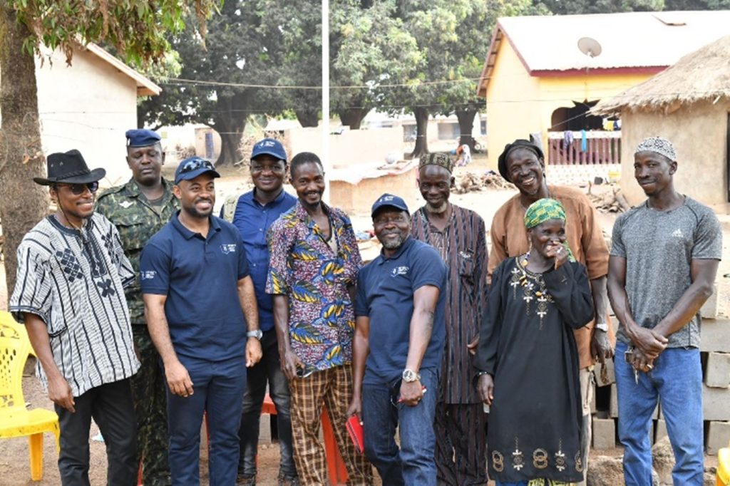 Image of Eric Ntube and other Seventy Ninth Resources employees visiting a local community in Guinea 