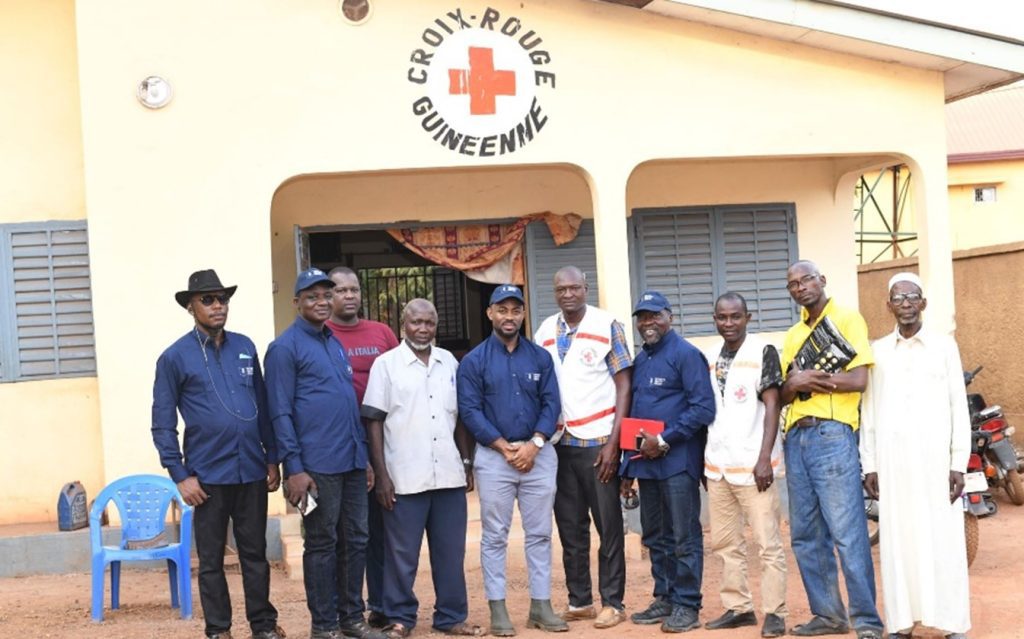 Seventy Ninth Resources staff and Red Cross workers outside the Red Cross building in Guinea 