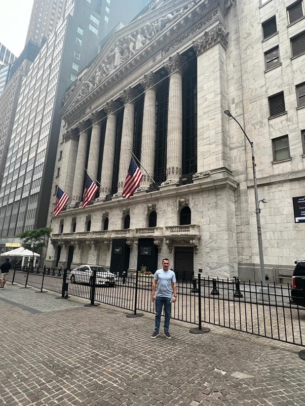 Photograph of Curtis Webster, Investment Director at the Seventy Ninth Group stood in front of a building in New York City.
