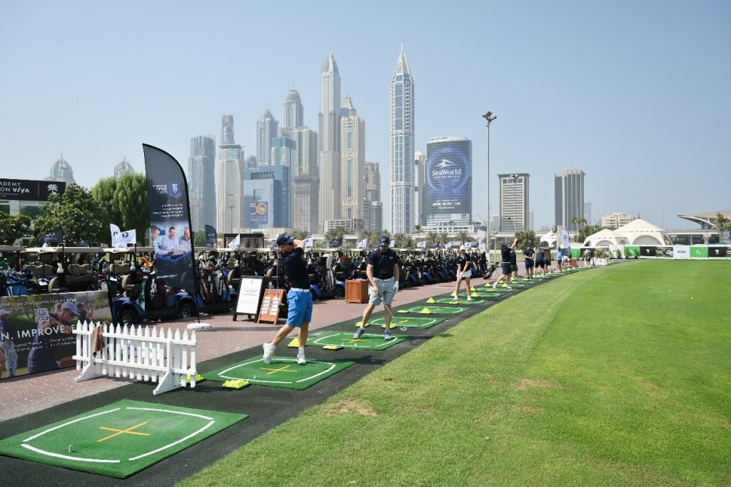 Picture of two people teeing off at the 79th Gold Invitational Dubai, 2023.